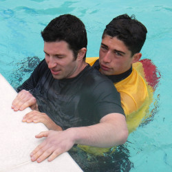 pool lifeguard doing a rescue